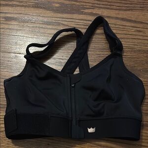 SHEFIT Luxe Black and rose gold sports bra.